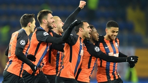 Shakhtar Donetsk midfielder Fred (2R) is mobbed after his goal