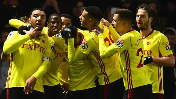 Troy Deeney is mobbed by his Watford team-mates