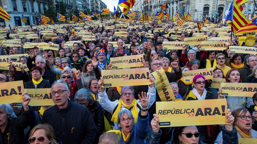 Pro-independence supporters take part in a rally to demand a Catalan government in Barcelona today