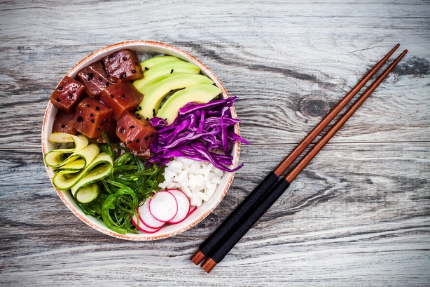 Hawaiian tuna poke bowl with seaweed, avocado, red cabbage, radishes