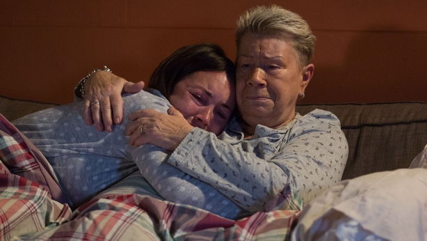 Mo Harris comforts Stacey after she breaks the news that Kat Slater is dead on EastEnders