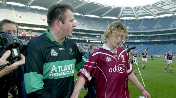 Nemo's Colin Corkery shakes hands with Ciaran McDonald of Crossmolina Deel Rovers after the 2003 All-Ireland club final