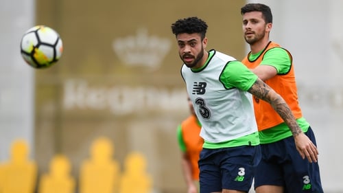 Derrick Williams, left, fends off the challenge of Shane Long in training