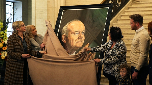 Members of the McGuinness family unveil the portrait