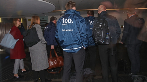 Enforcement officers working for the UK Information Commissioner's Office entering the offices of Cambridge Analytica this evening
