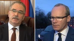 Yury Filatov (L) said expulsions will not go unanswered, while Simon Coveney said Ireland will show solidarity with its closest neighbour
