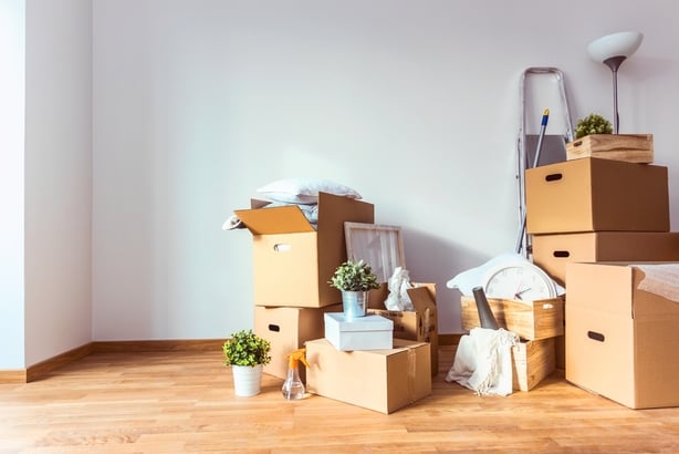 Cardboard boxes and cleaning things for moving into a new home