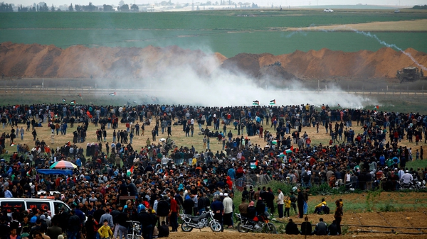 Tear gas is fired at the crowds gathered at the border