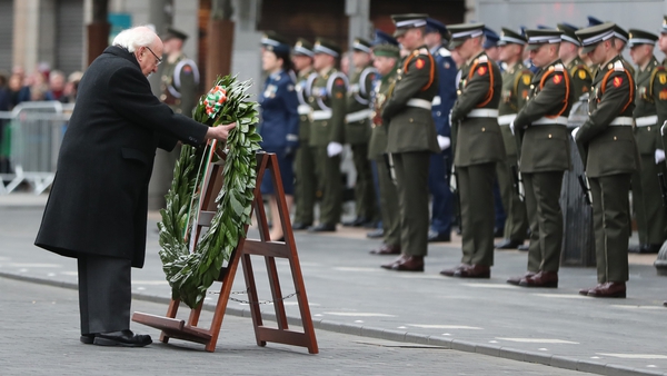 President Michael D Higgins lays a wreath outside the GPO