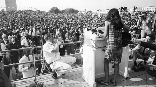 Joan Baez performing at the Civil Rights March on Washington in 1963. Photo: Getty Images