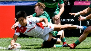 osuke Hashinio of Japan dives in to score a try