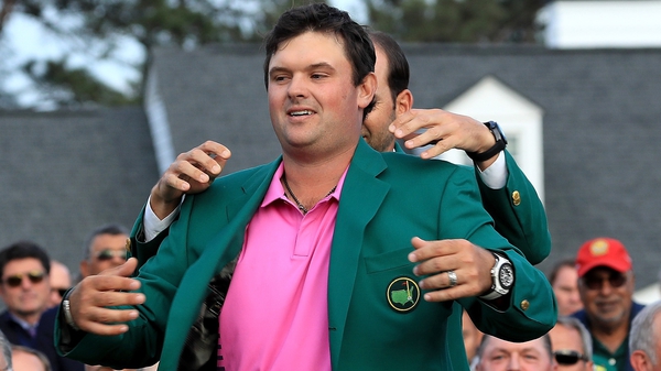 Patrick Reed slips on the Green Jacket
