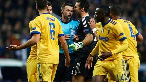 Gianluigi Buffon confronts referee Michael Oliver