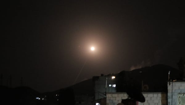 A missile from the Syrian Arab Air Force attempts to intercept a coalition missile in the skies above Damascus