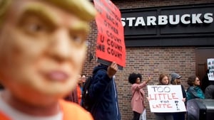 People demonstrate outside a Starbucks in Philadelphia after police arrested two black men in one of its stores