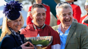 Michael O'Leary (R) and his wife Anita celebrate winning the Grand National with jockey Davy Russell