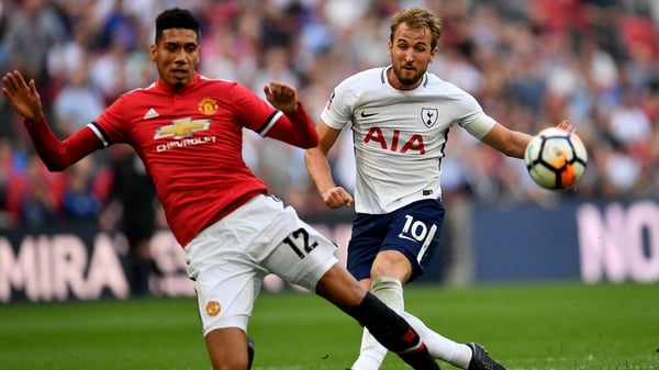 Manchester United defender Chris Smalling challenges Harry Kane during the FA Cup semi-final