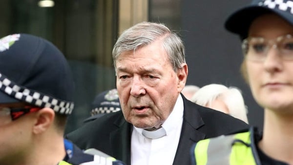 Cardinal Pell leaving court after the prosecution and defence agreed to press for two separate trials