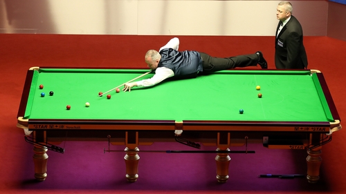 John Higgins in action against Kyren Wilson