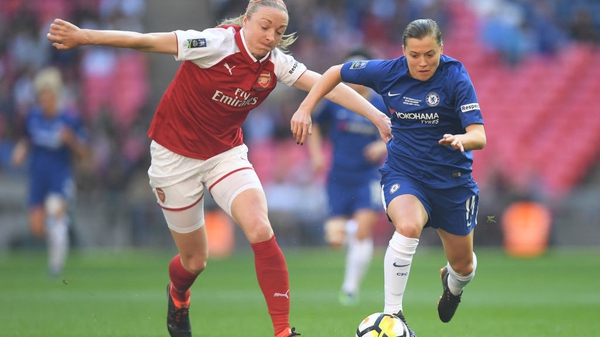 Fran Kirby of Chelsea holds off the challenge of Louise Quinn