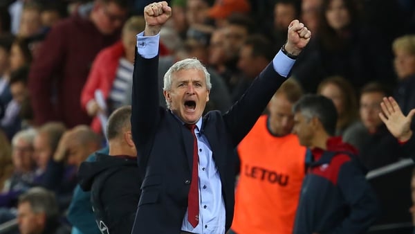Mark Hughes celebrates after his team's victory