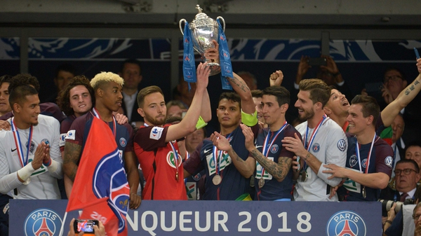 PSG captain Thiago Silva (R) and Les Herbiers skipper Sebastien Flochon raise the trophy