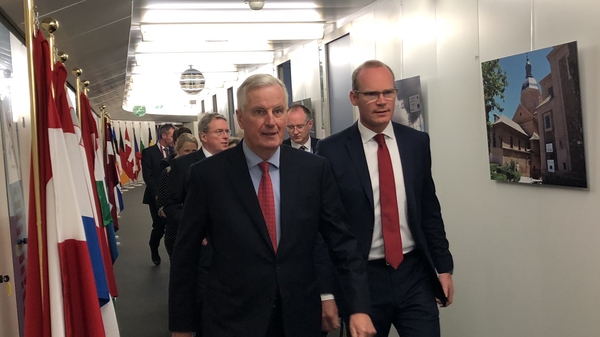 Tánaiste Simon Coveney (R) and the EU's Michel Barnier in Brussels