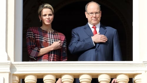 Princess Charlene pictured with Prince Albert on the palace's balcony in Monaco in 2018