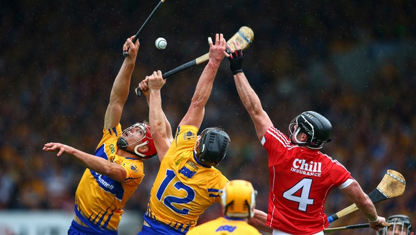 Clare's Peter Duggan and John Conlon compete with Cork defender Colm Spillane during the 2017 Munster final
