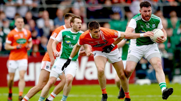 Armagh's Gregory McCabe and Seamus Quigley of Fermanagh battle for possession