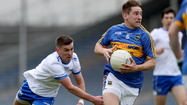Tipperary's Bill Maher gets away from Gavin Crotty