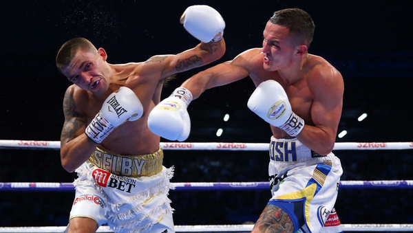 Josh Warrington lands a right shot on Lee Selby