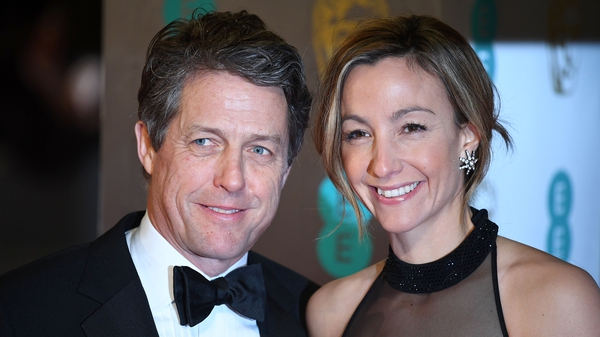 Hugh Grant and Anna Eberstein at the BAFTAs in London in February 2017