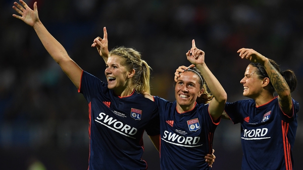 Camille Abily of Lyon (C) celebrates scoring her side's fourth goal with Ada Hegerberg (L) and Dzsenifer Marozsan