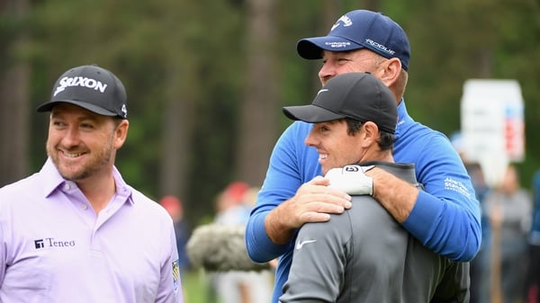Graeme McDowell, Thomas Bjorn and Rory McIlroy share a laugh on the 11th tee