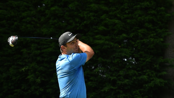 Rory McIlroy holds a share of the lead
