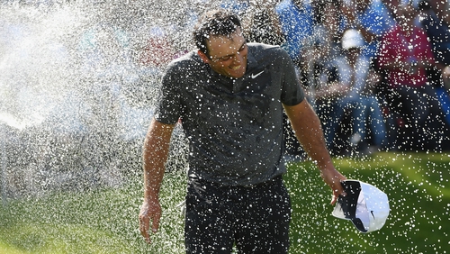 Francesco Molinari is soaked with champagne