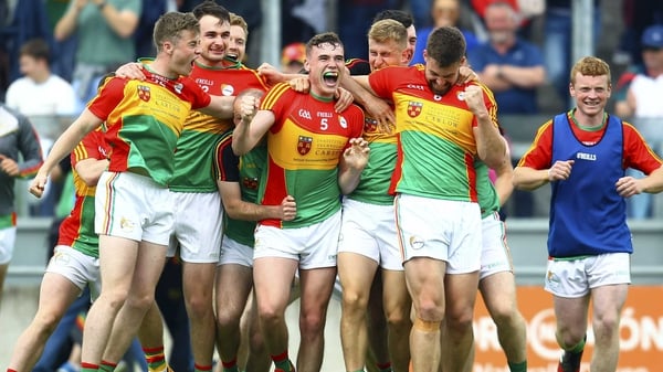 Ecstatic Carlow players celebrate at the final whistle