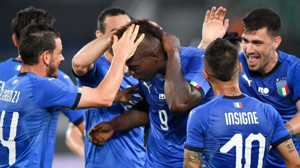 Mario Balotelli is mobbed by his team-mates