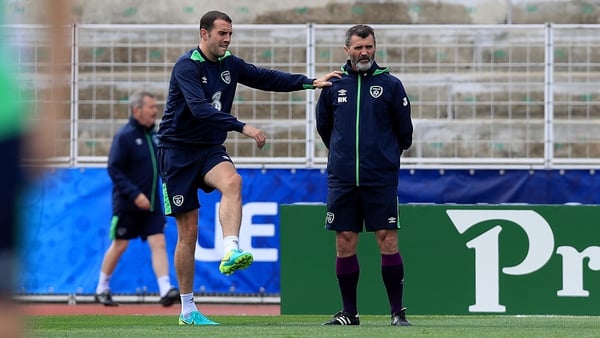 John O'Shea with assistant manager Roy Keane