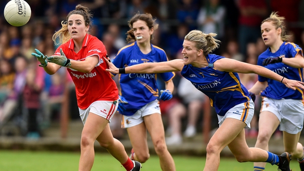Orlagh Farmer of Cork in action against Jennifer Grant of Tipperary