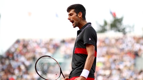 Novak Djokovic reacts during his French Open tie against Marco Cecchinato.