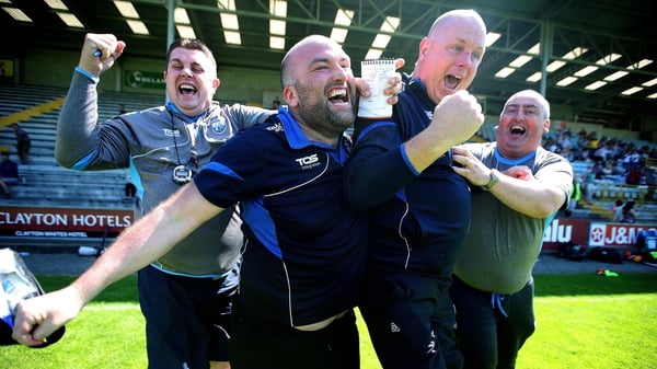 Waterford manager Tom McGlinchey and his back room team celebrate at the final whistle