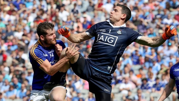 Will he or won't he? Cluxton was injured after this hit from Longford's James McGivney