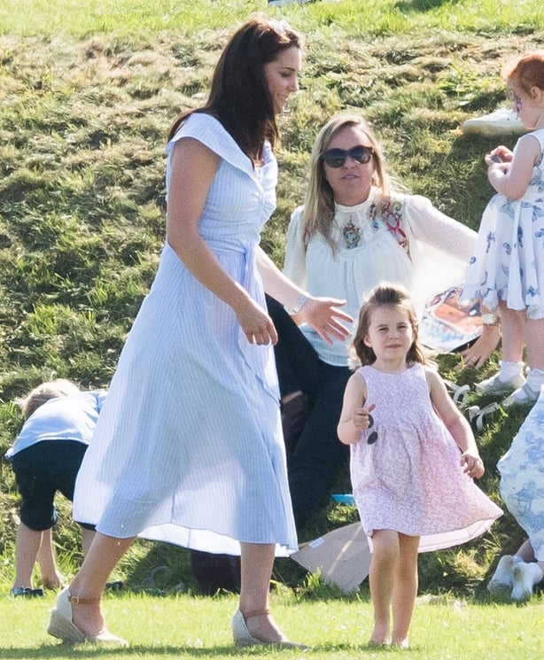 Duchess of Cambridge and Princess Charlotte of Cambridge attend the Maserati Royal Charity Polo Trophy at Beaufort Park