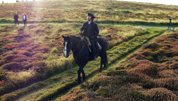 Aidan Turner rides Seamus over heathland on Gwennap Head on the Cornish coast during filming recently for series three of the BBC One hit Sunday night drama Poldark.
