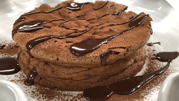Chocolate Souffle Cake with Chocolate Sauce and Raspberries