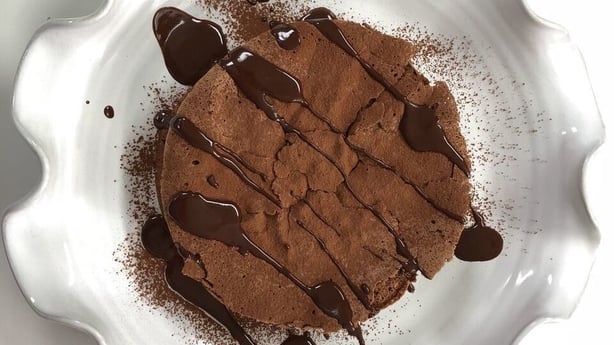Chocolate Souffle Cake with Chocolate Sauce and Raspberries