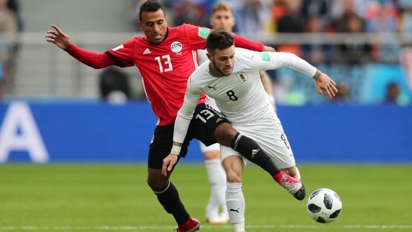 Mohamed Abdelshafy of Egypt tackles Nahitan Nandez of Uruguay