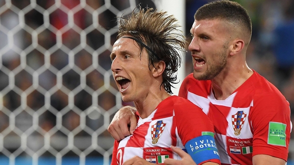 Luka Modric celebrates scoring a penalty with his teammate Ante Rebic